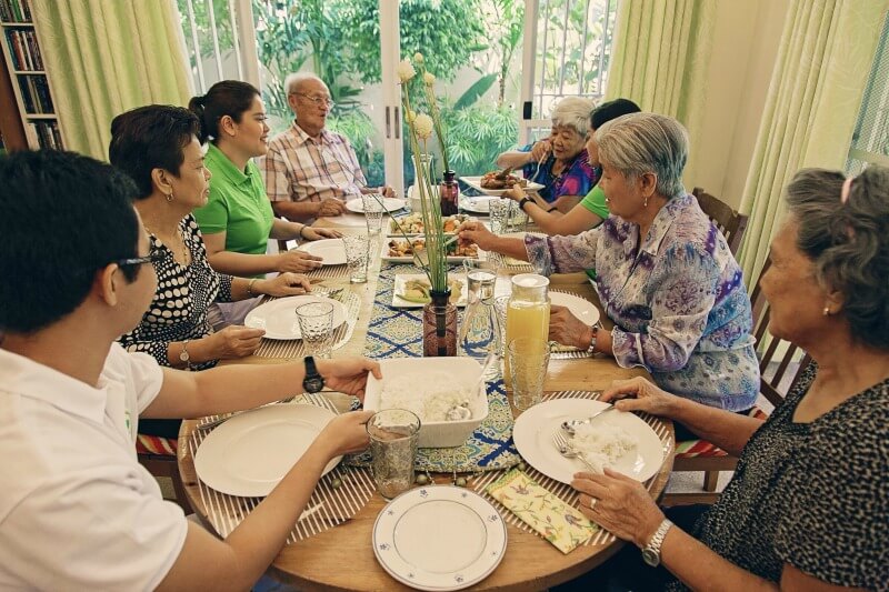 Staff And Seniors Dining At Raintree Care Services Senior Residences