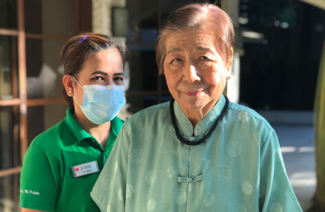 Smiling Senior With Caregiver
