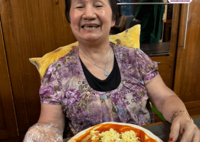 A Happy Senior During Our Pizza Making Activity